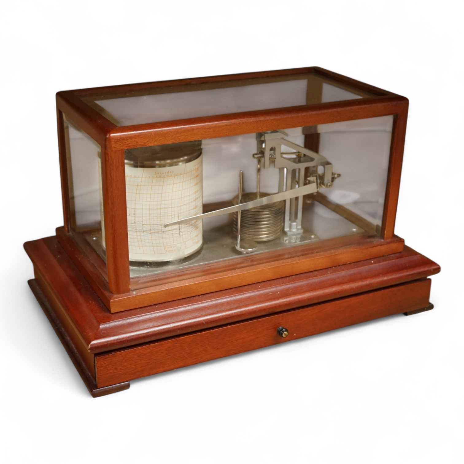 A 1970s Casella mahogany cased barograph with bevelled glass panels and a drawer underneath containing a good quantity of paper slips and instruction leaflet.